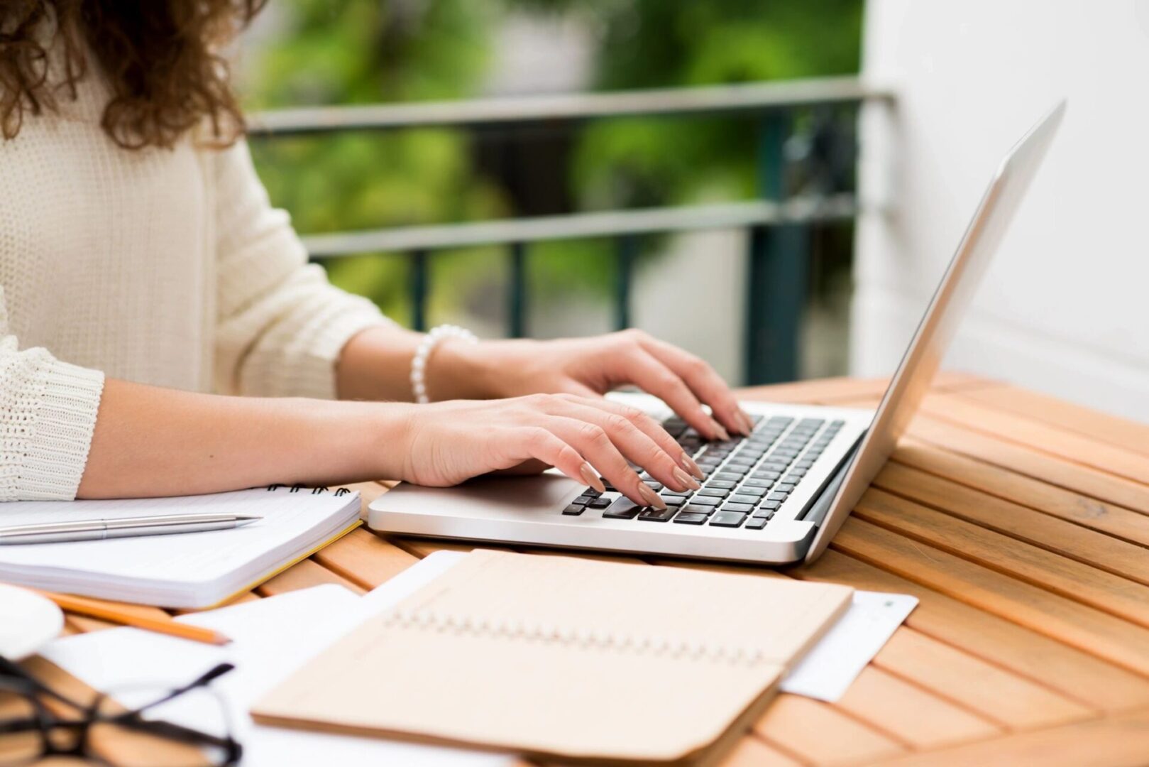 A person typing on a laptop computer.